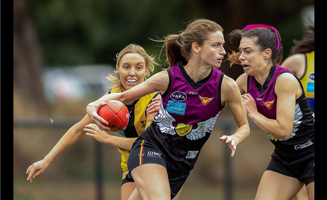 The Hearts opened their season with a strong win over St Mary's Salesian; here Joyce Dunne swings forward, shepherded by Amy Fletcher