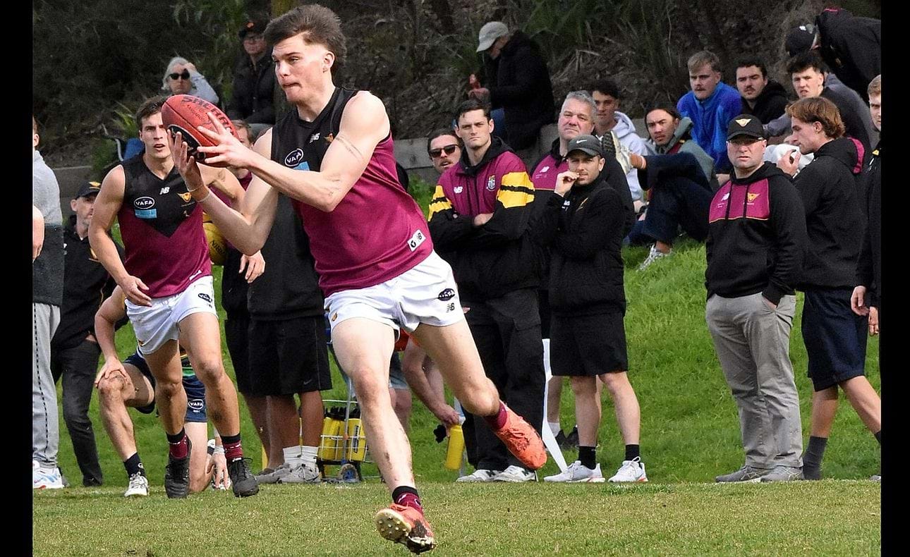James Blight on the run with a strong crowd of support behind him