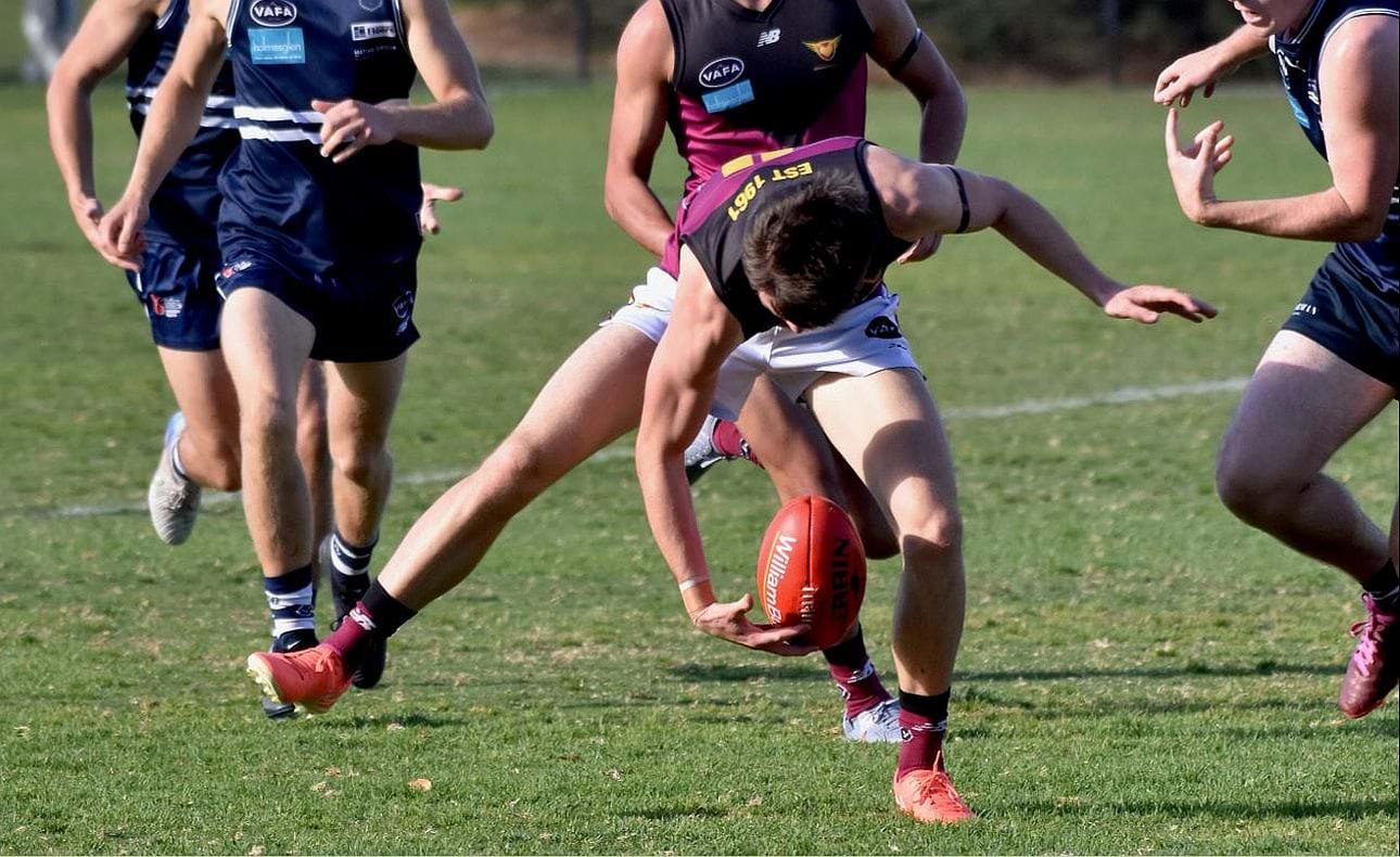 James Blight with head over the ball