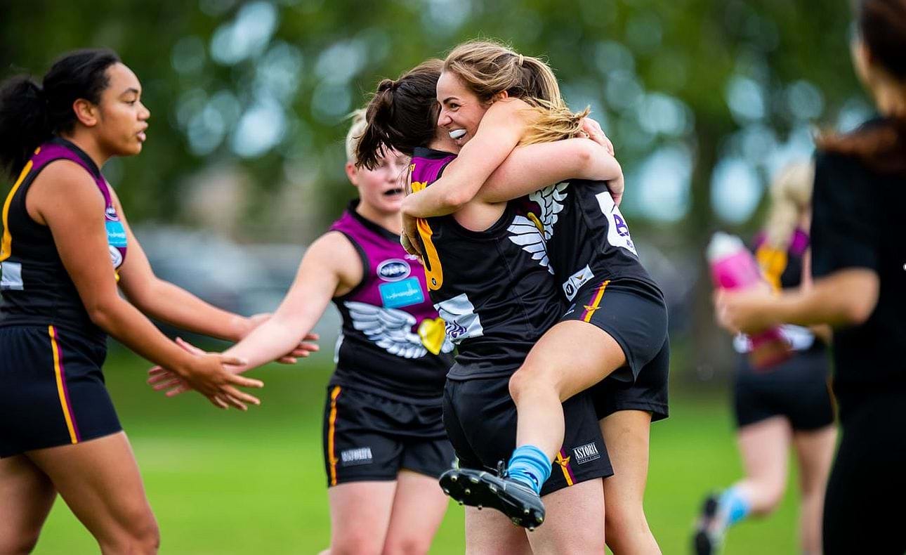 The joy of kicking goals; Jordan Shanks and Taylah Vines-Chapple embrace while Serene Vudiniabola and Kathryn Spencer share a quiet high five in the background