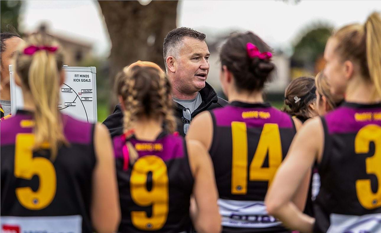 Coach Sean Brady addresses his charges