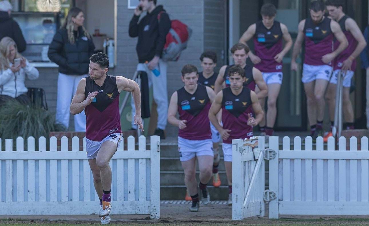 Brede Seccull leads the team out at Toorak Park