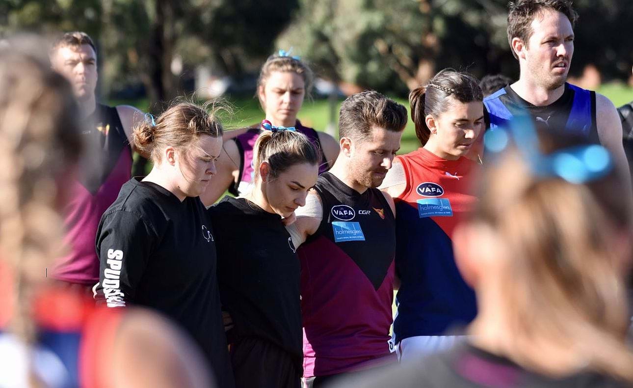 Hearts captain Bridget Hanrahan and Taylah Vines-Chapple, senior captain James Paul and captains of Old Brighton and University Blues line up in the pre-match ceremony for "Spud's match" in Round 9