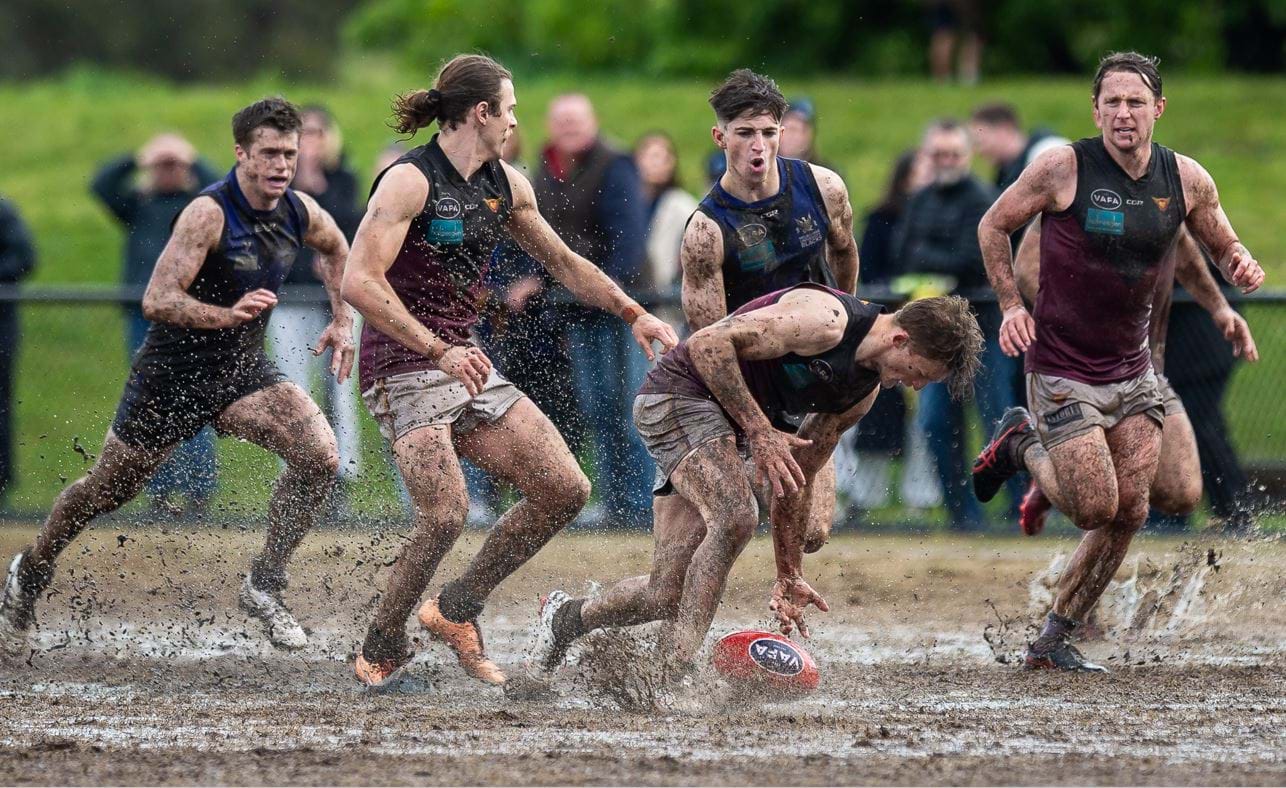 Rayner Seccull stoops in the mud backed up by Will Paul and Peter Gleadhill