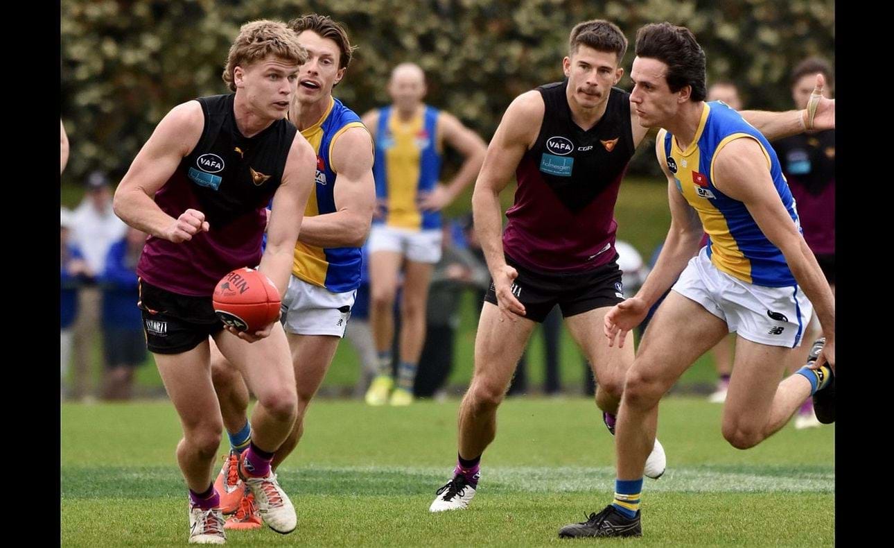 Hugo Nosiara clears under the watchful eye of Connor Riley