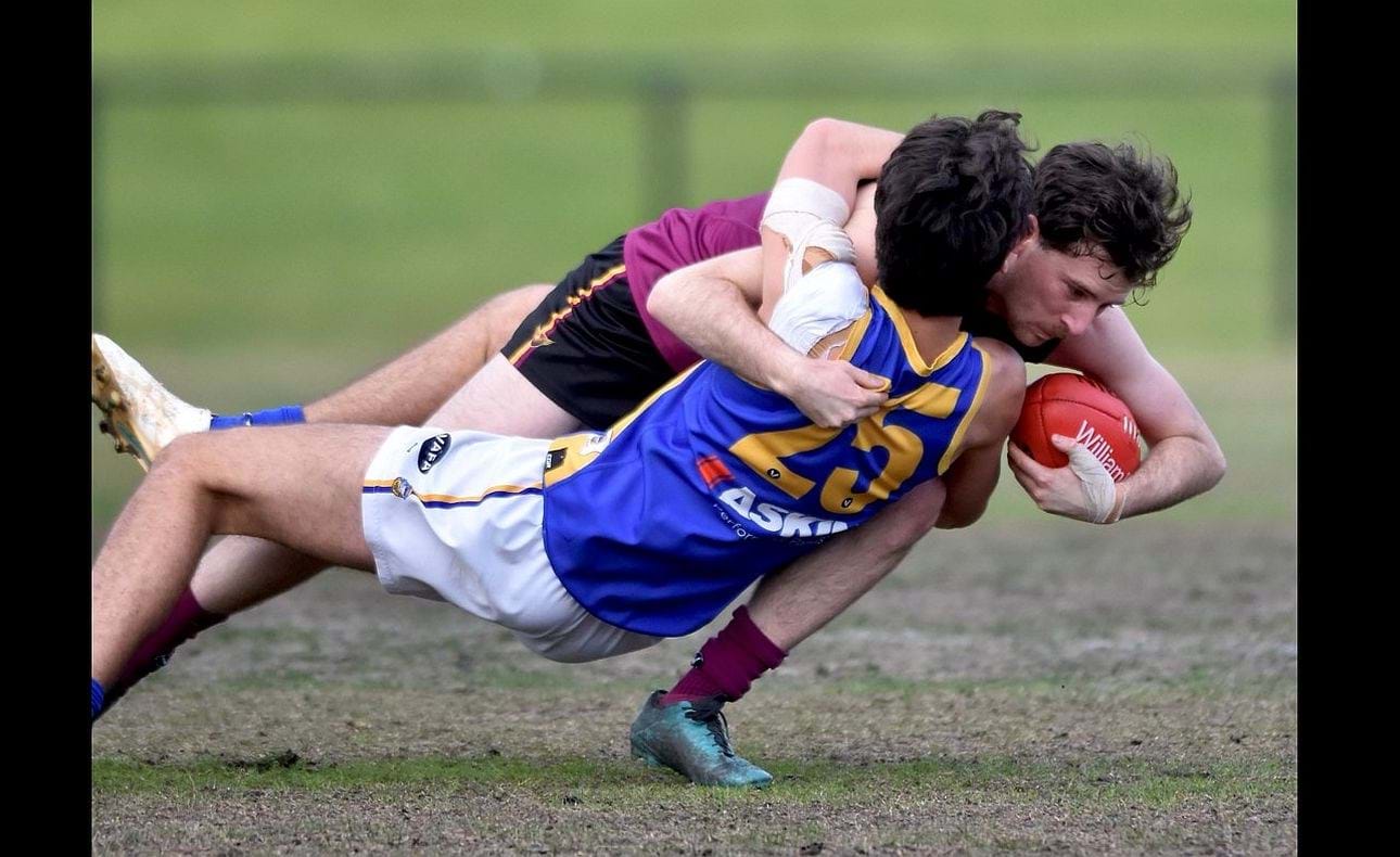 Joel Constable takes down both the ball and opponent in a tackle
