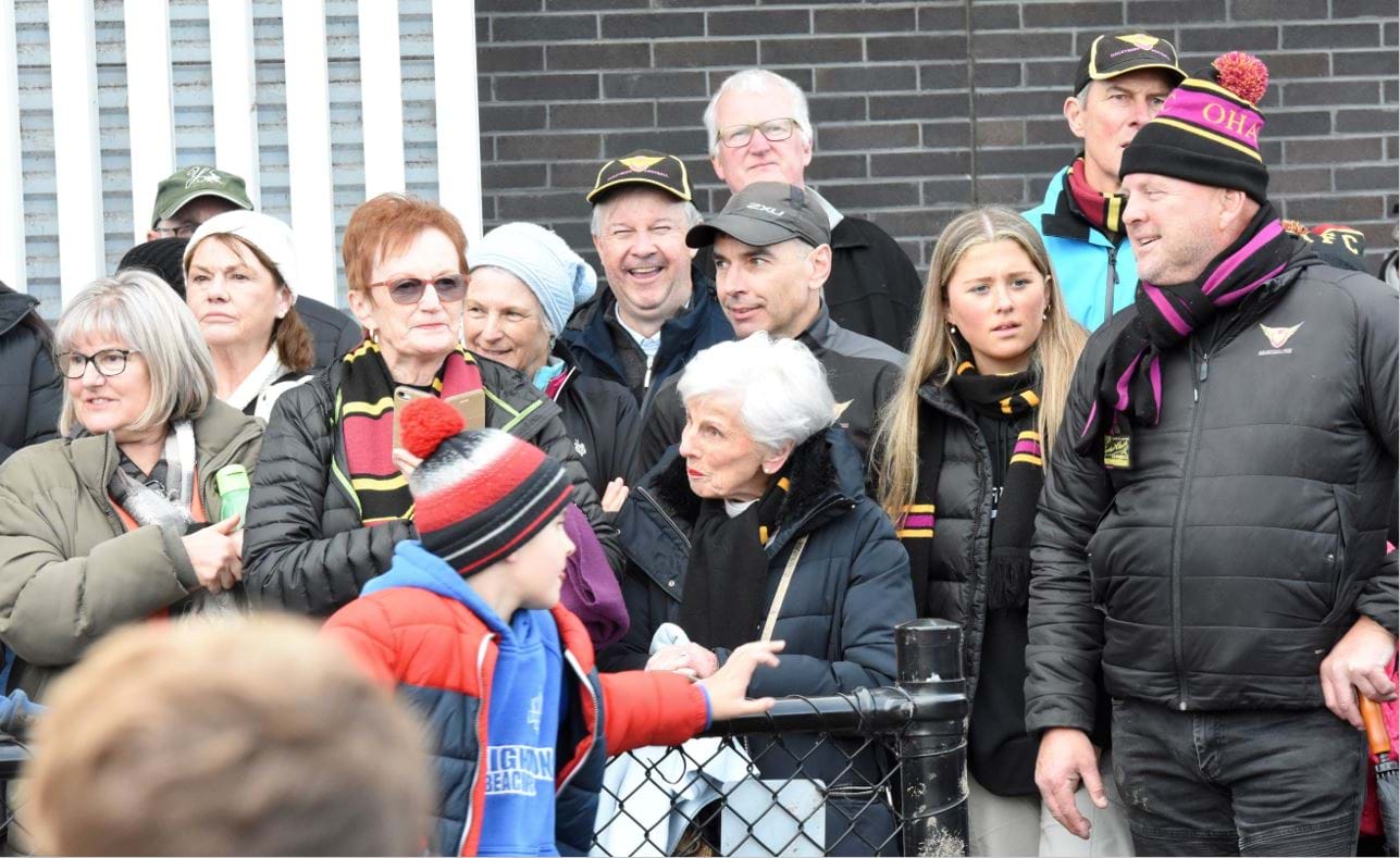 Happy Haileybury faces in the crowd after the siren