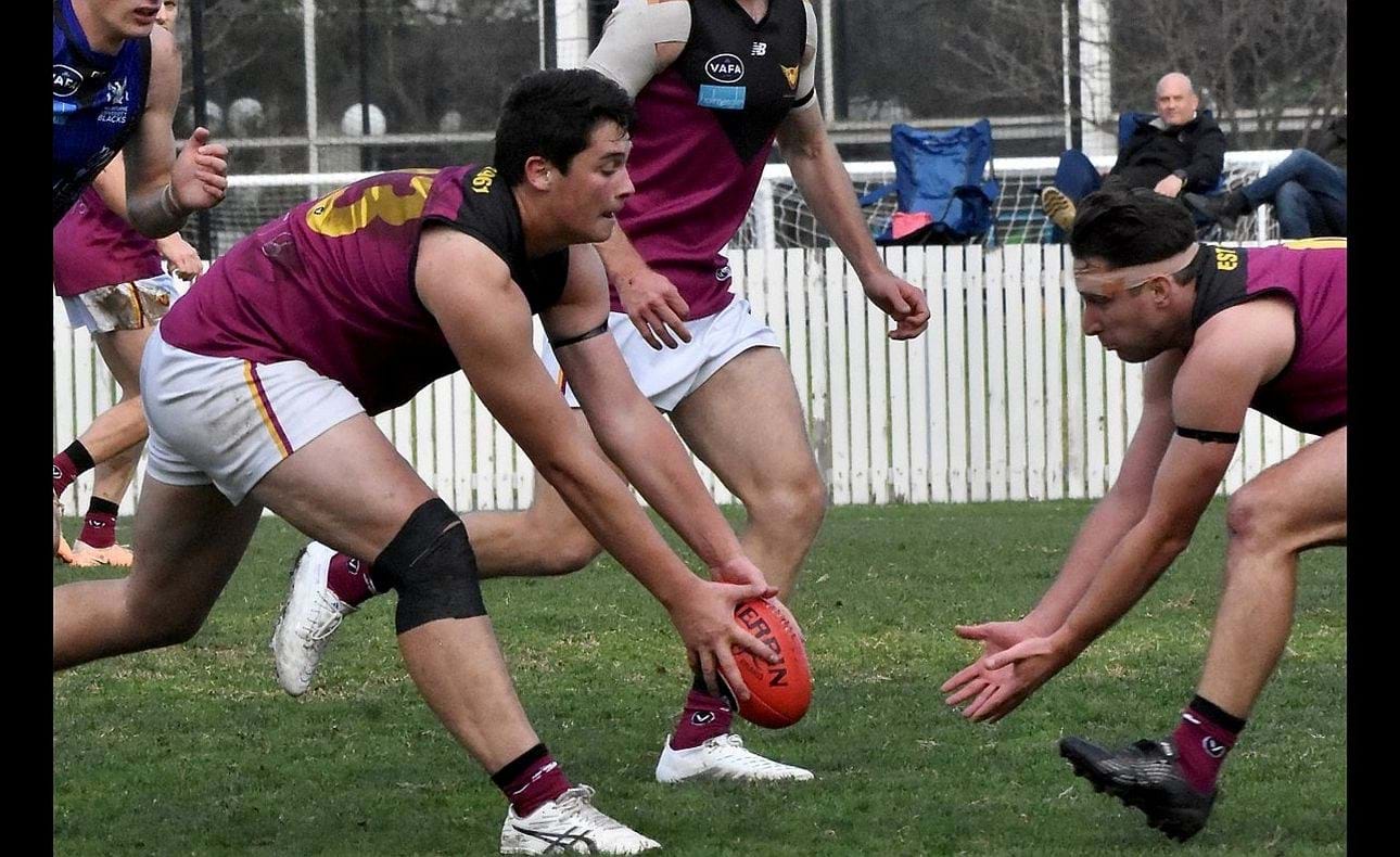 Ethan Hardeman just beats bandaged up team mate Peter Gleadhill to the ball