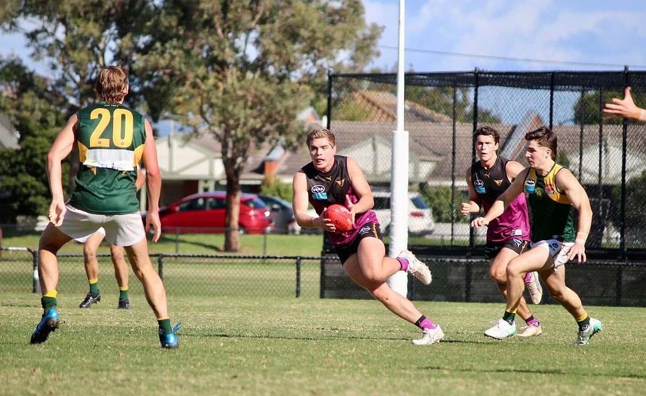 Liam Wood breaks away from the pack