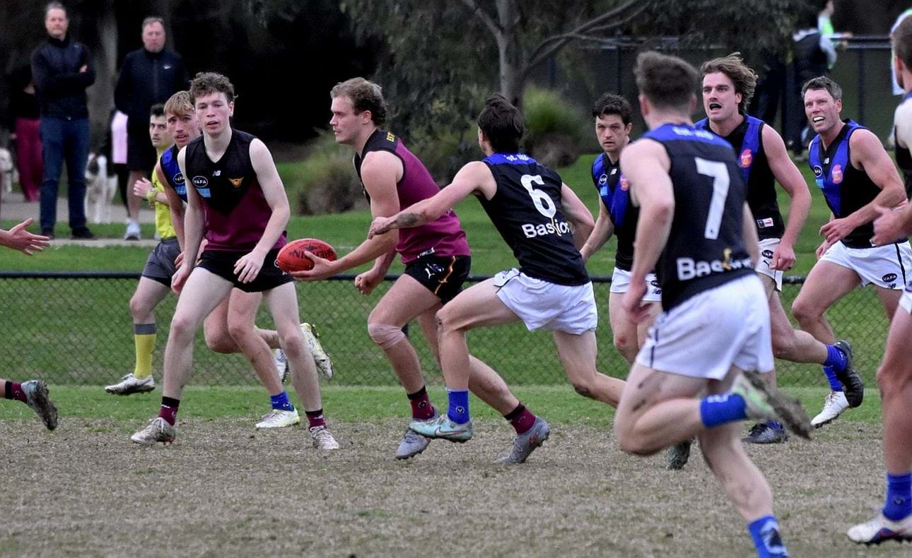 Joel Chilcott pursued by five Uni Blues players, Lucas Hornblower nearby