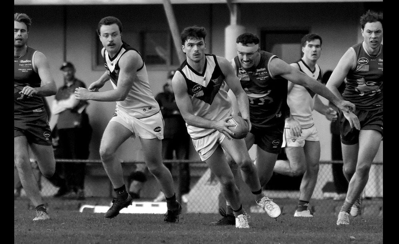 Olli Hotton clears with Max Sievers in support