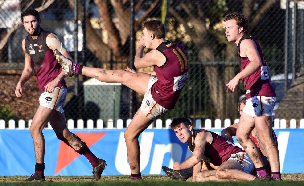 Will Gown (11) clears late in the day watched by team mates Jack Bell, Josh Gasparini and Max Sievers