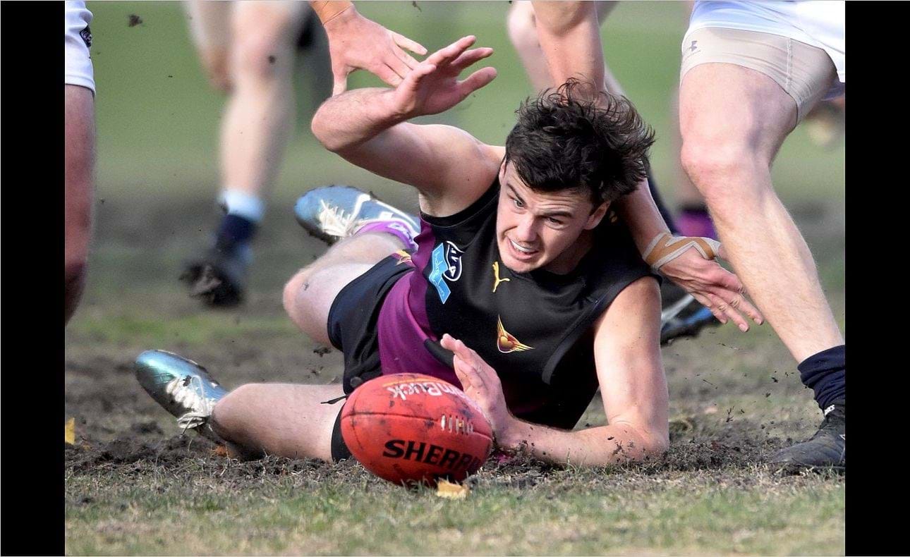 Lachie Vaughan reaches desperately for the ball