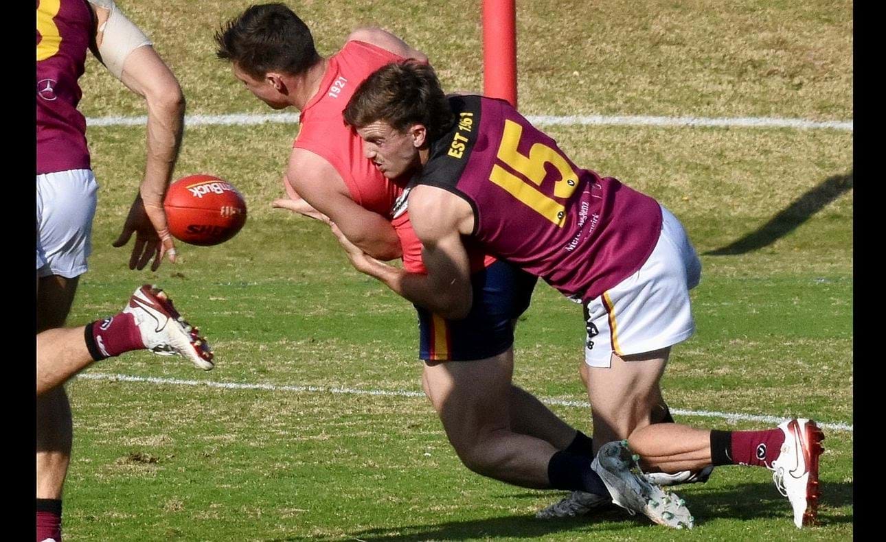 Will McPhee (15) wraps up his Old Scotch opponent