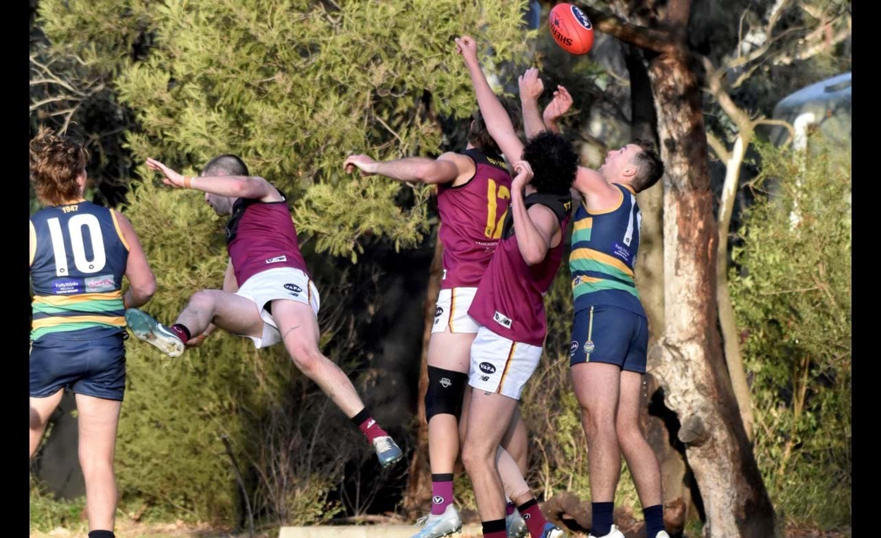 Hugo Lynch (12) effects another spoil with help from the tumbling Dre Stefanakis and Jack Bell behind