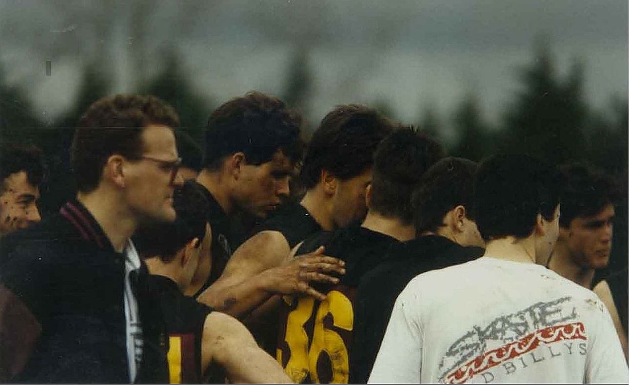 The reserves at their quarter time break against Uni Blues
