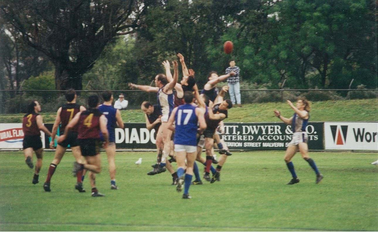 Andrew Walden, Darren Seccull and Nik Morey all in a large pack against Mazenod; Wes Byrns (3), Sean Ralphsmith (7) and Chris McKenzie (4) await the outcome