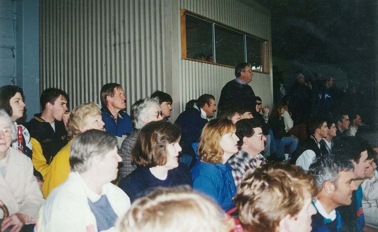 The crowd shelters from the weather at Elsternwick Park, 1995 Grand Final