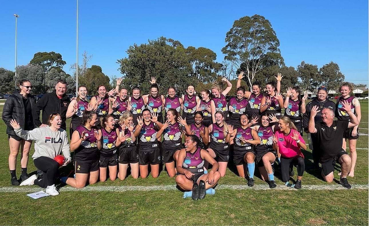 The Hearts celebrate the record 9-goal haul of Serene Vudiniabola (seated at the front) against Therry Penola in Round 7