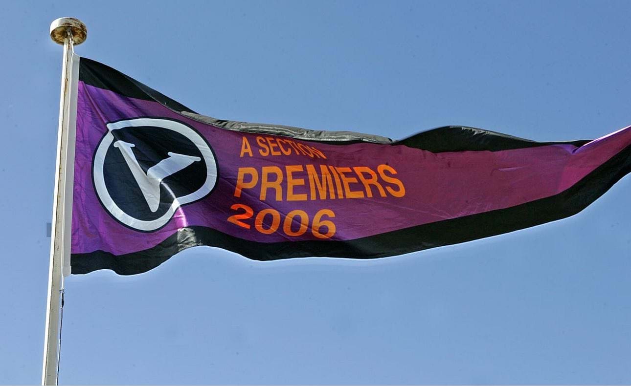 The Bloods' 2006 A Grade flag flutters in the McKinnon wind in the opening game of the 2007 season against Old Scotch
