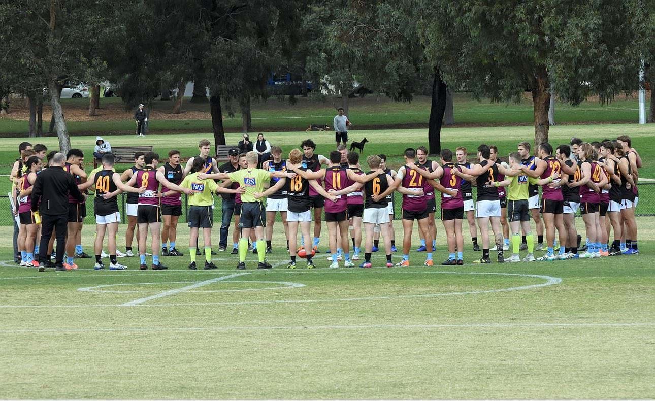 Prior to the Senior fixture both teams lined up for "Spud's Match"