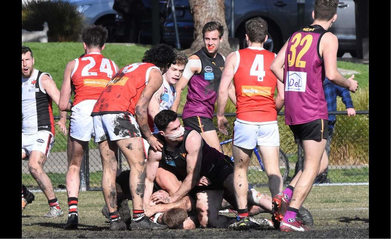 A muzzled Brede Seccull at the bottom of the pack