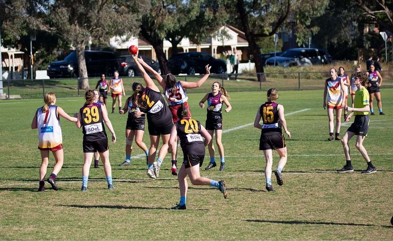 Chelsea Frawley (2) in the ruck surrounded by team mates Bridget Hanrahan (39), Alana Hall (20) and Peta Simkin (15)