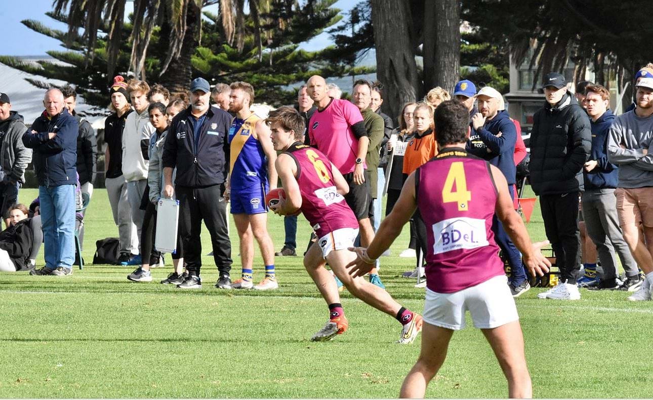 Josh Gasparini (6) in front of the Williamstown crowd and team mate Sam Algeri (4)